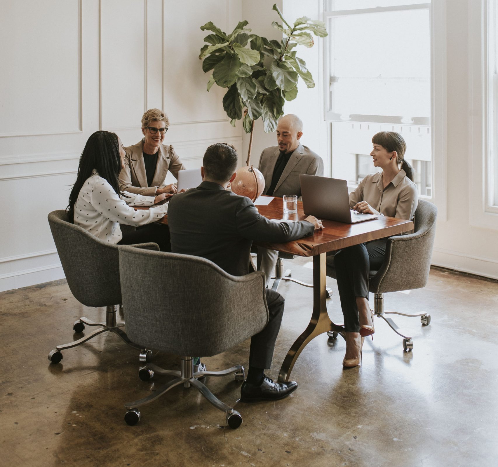 happy business people in a meeting 2022 12 15 22 55 58 utc min scaled e1695801204830
